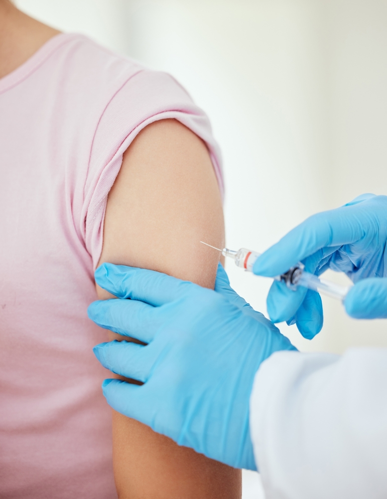 Closeup, gloves and syringe with vaccine